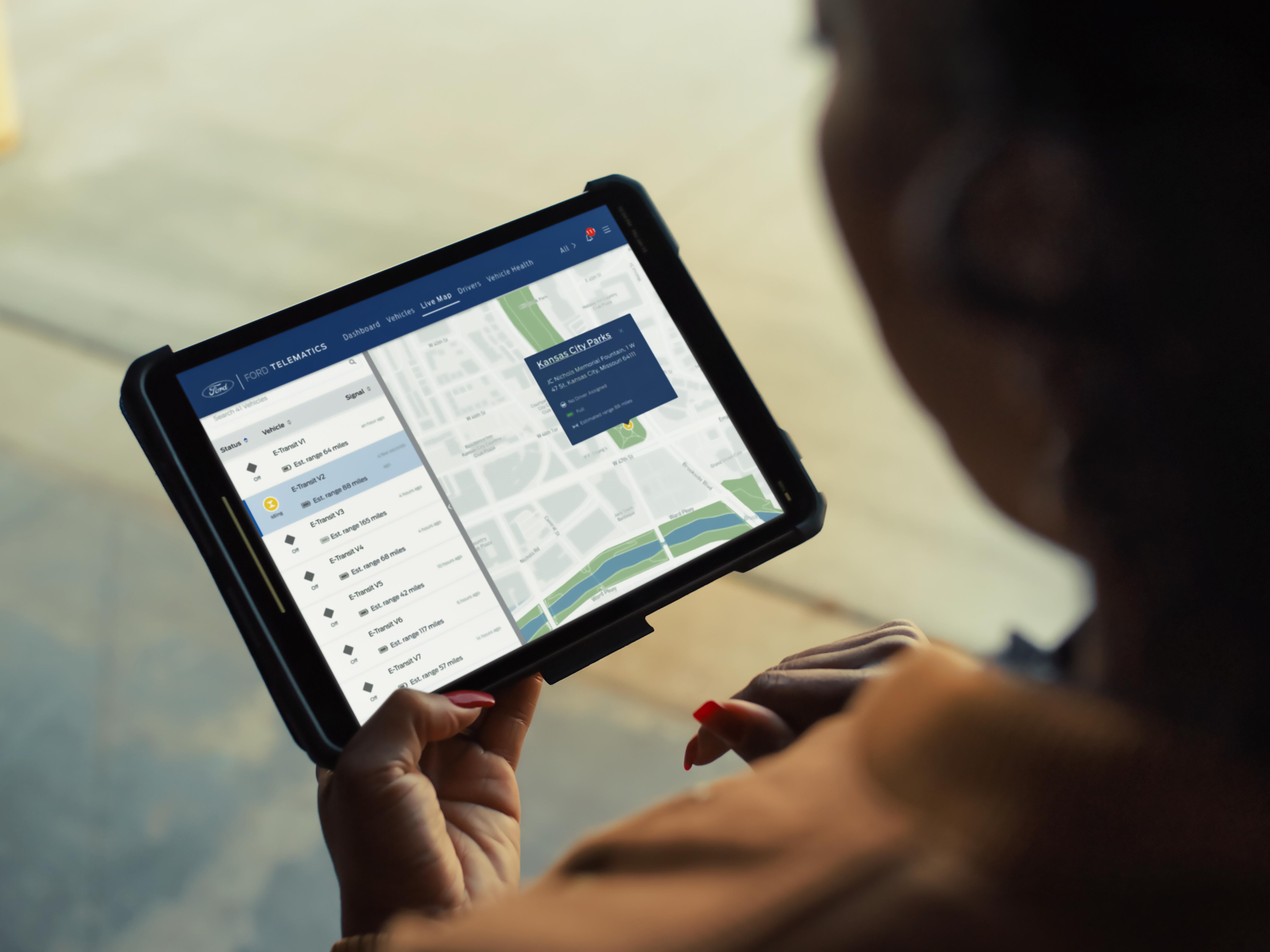 a guy looking at a tablet
