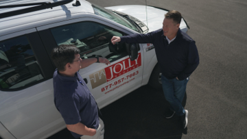 a guy looking at a tablet