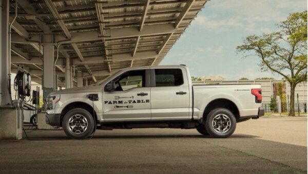 Work truck charging at public charging station.