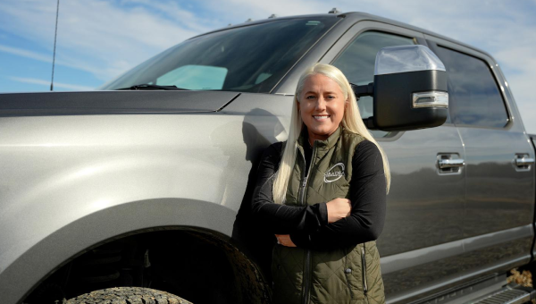 Photo of Jessica Cox standing nest to a Ford vehicle.