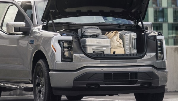 A gray 2024 Ford F-150 Lightning pickup truck with the front trunk, or frunk