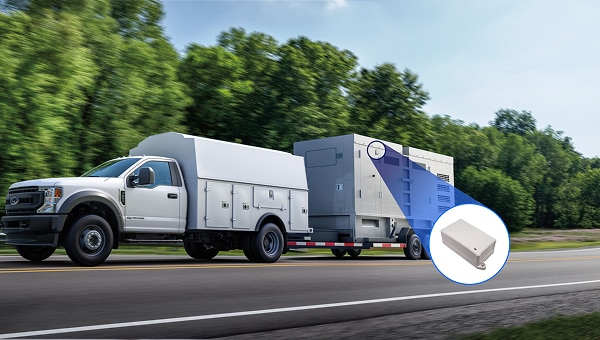 Image of a Ford F-550 XL towing a large generator on a highway.