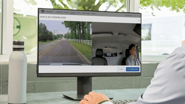 Man looking at split screen of Dascam footage on a desktop computer in an office