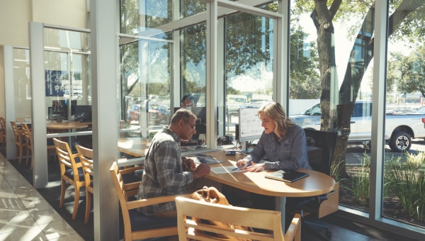 Two people sitting at a table.