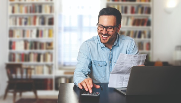 Customer reviewing finance documents at home office