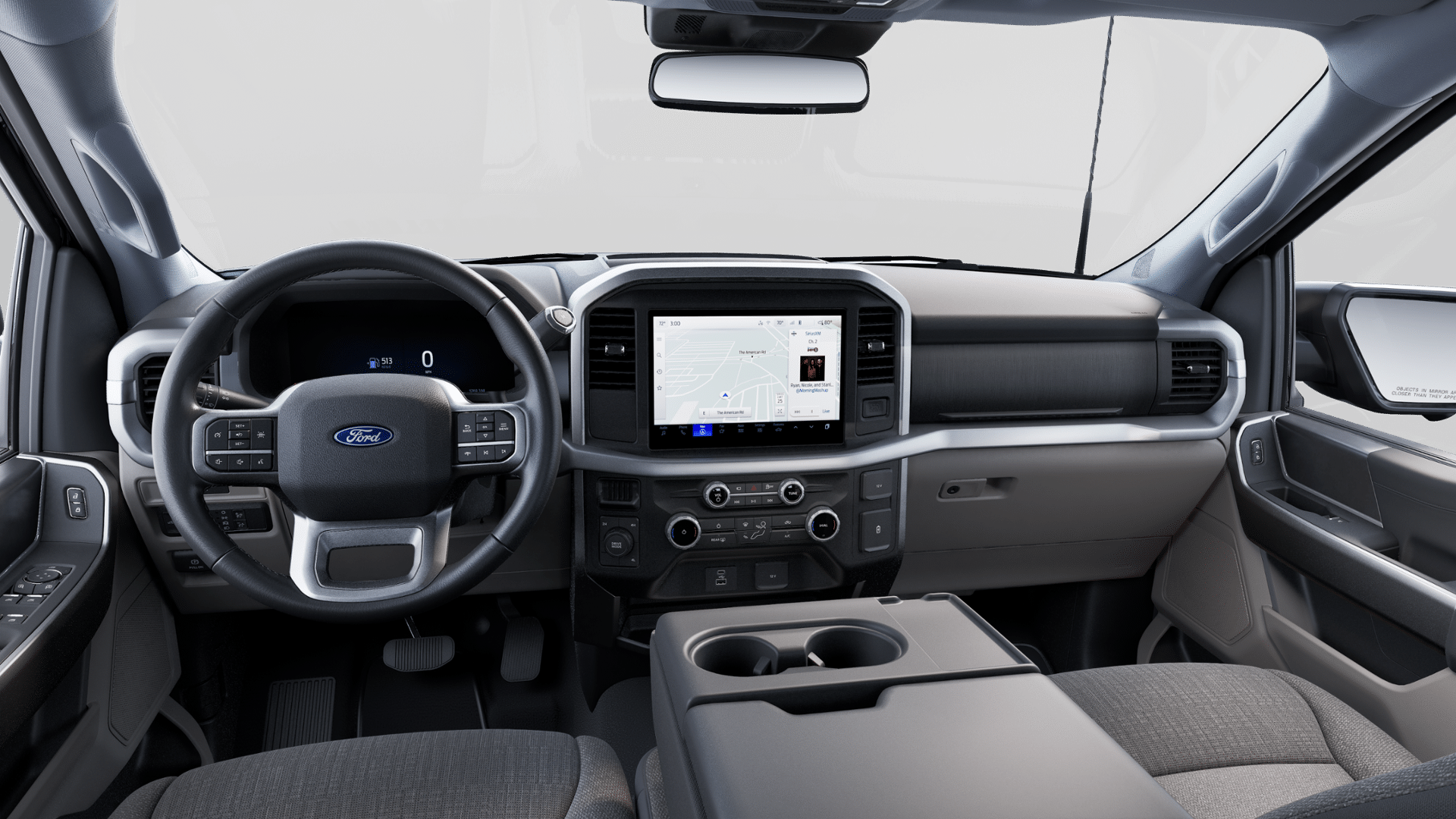Interior de F-150 con volante, cluster digital y pantalla central.