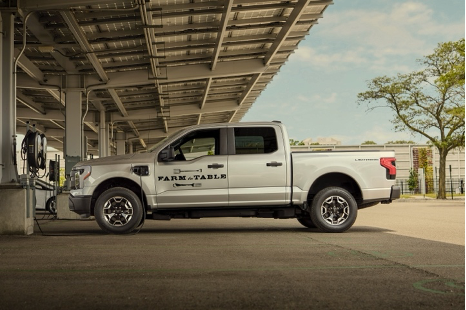 Work truck charging at public charging station