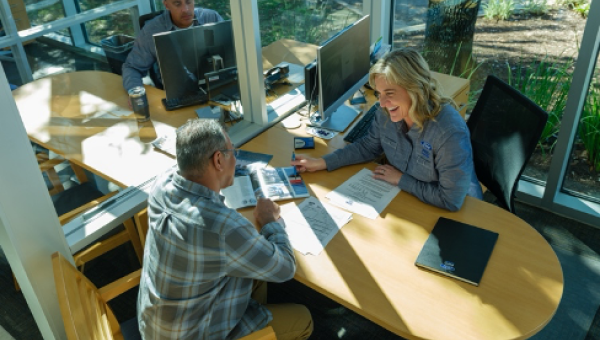 A Ford Pro finance expert discussing financing options with a new customer