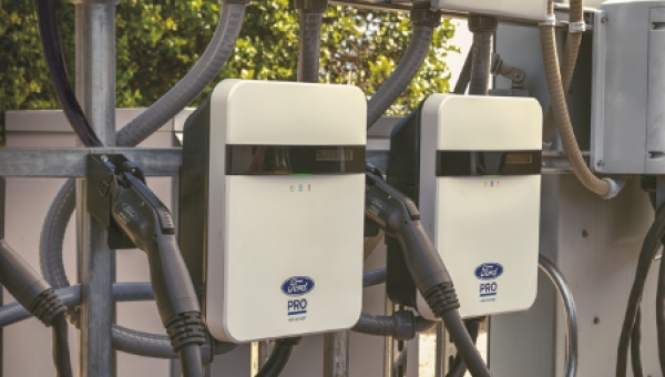 Two Ford Pro AC Chargers at a charging station