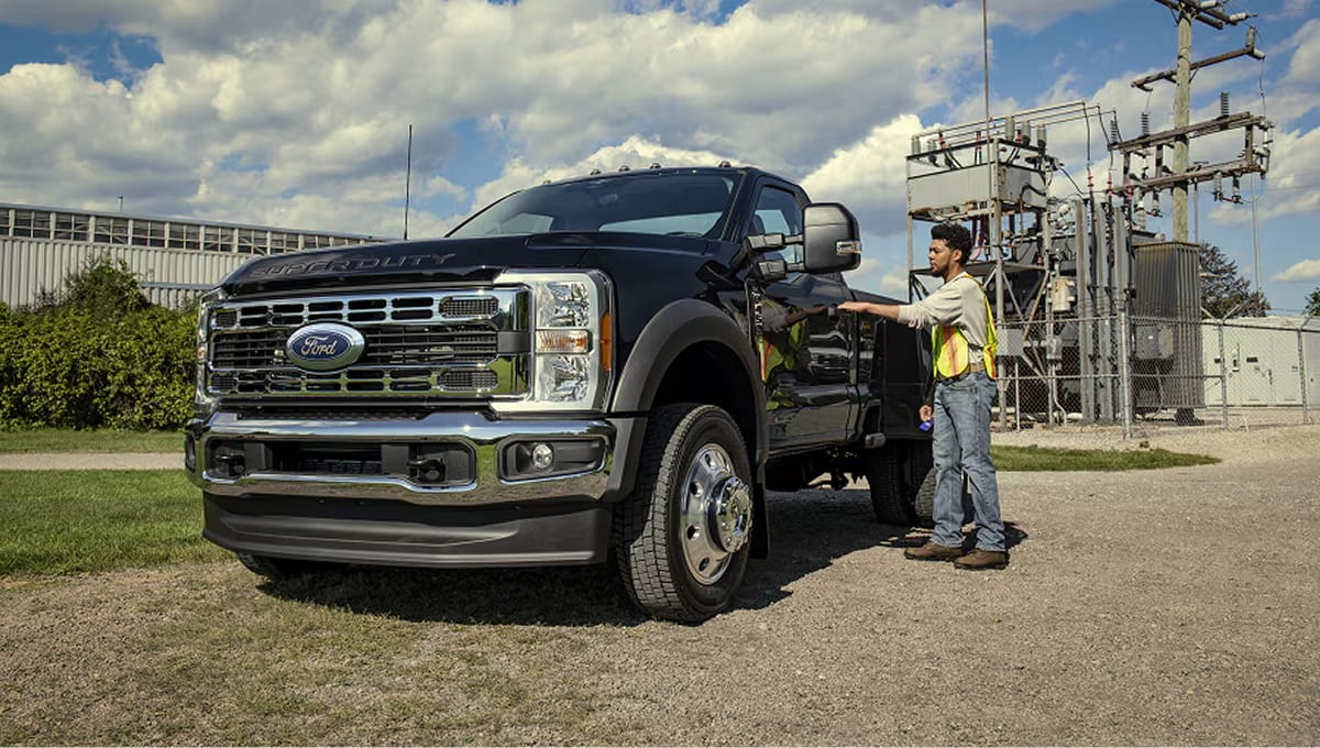 A person opening the driver door of their 2026 Ford Super Duty F-450 XL model with the Chrome Appearance Package.