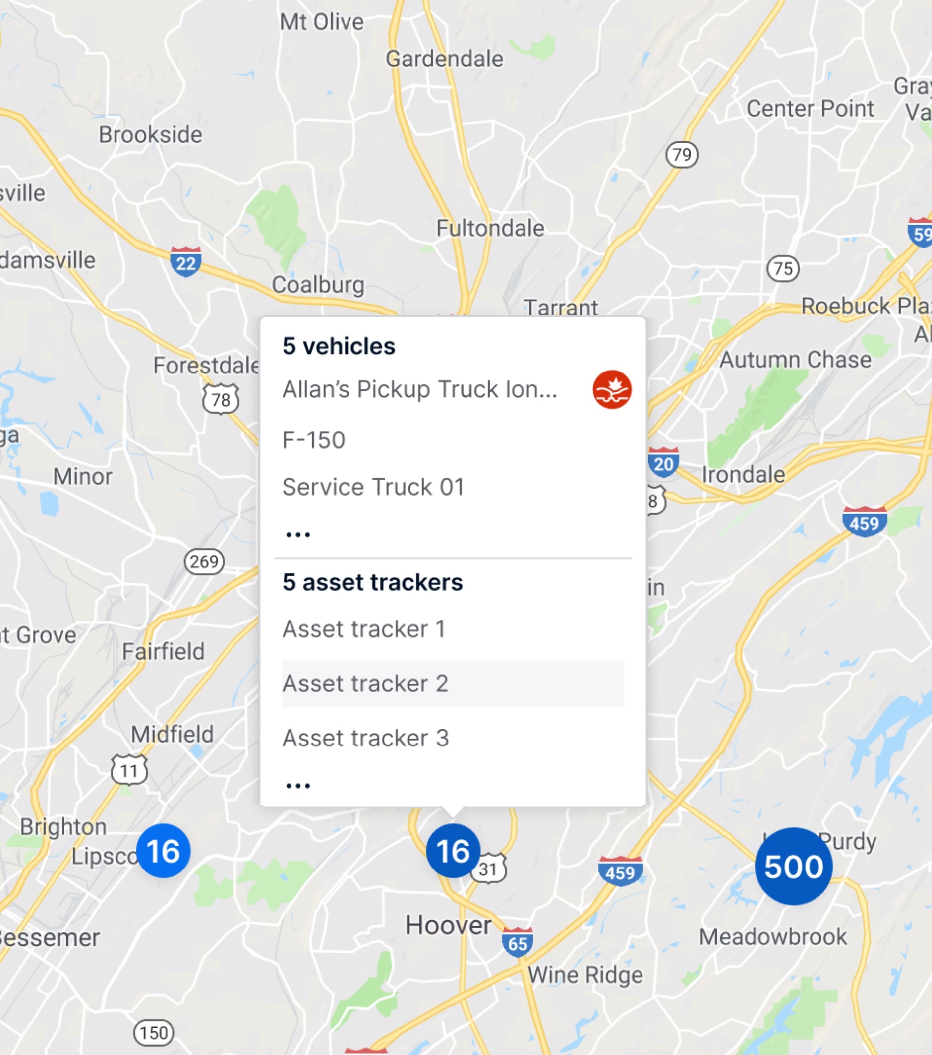 A zoomed-out map showing clusters representing multiple vehicles and asset trackers. A pop-up box displays grouped lists for five vehicles and five asset trackers, showing how the new clustering helps reduce clutter and makes the map easier to read.