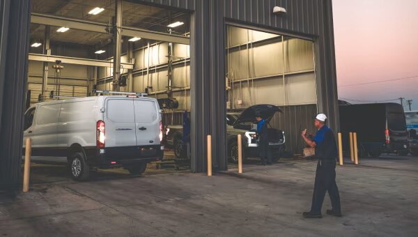 Exterior view of the large service bay at a Ford Pro Commercial Vehicle Center.