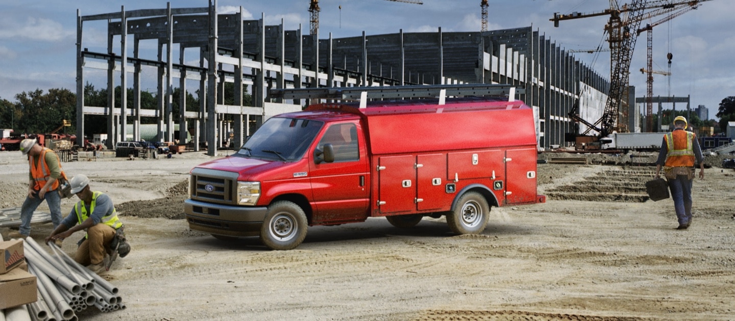 Red 2024 E-Series Cutaway Chasis ford truck equipped for an electrician with many panels and compartments