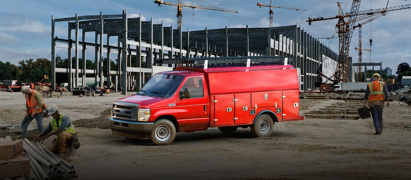 2027 Ford E-Series Cutaway with drive upfit parked at construction site