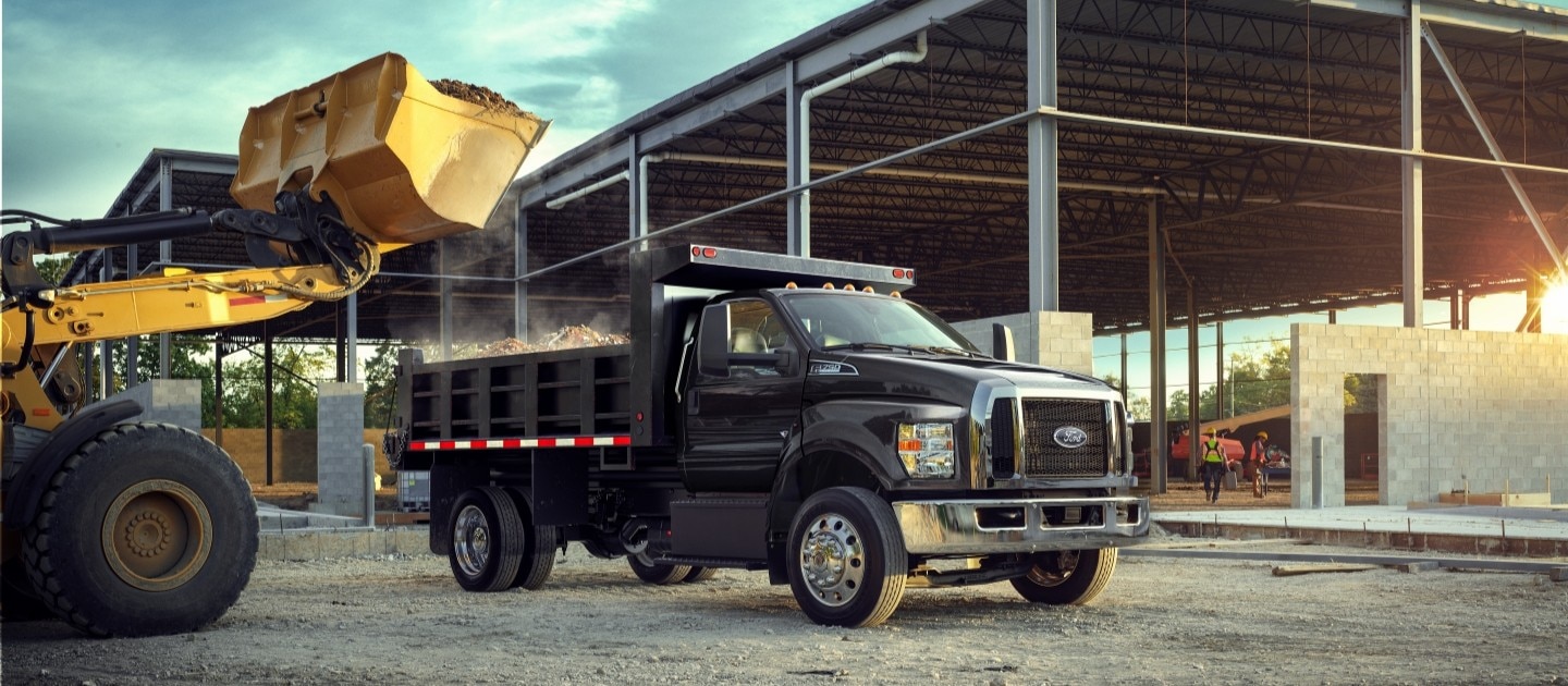 2027 Ford F-750 Regular Cab in Agate Black with dump truck upfit at work site