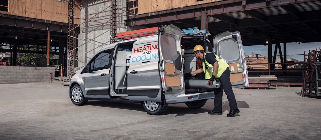 The built Ford tough® 2023 Ford Transit Connect Cargo Van in Silver on a job site
