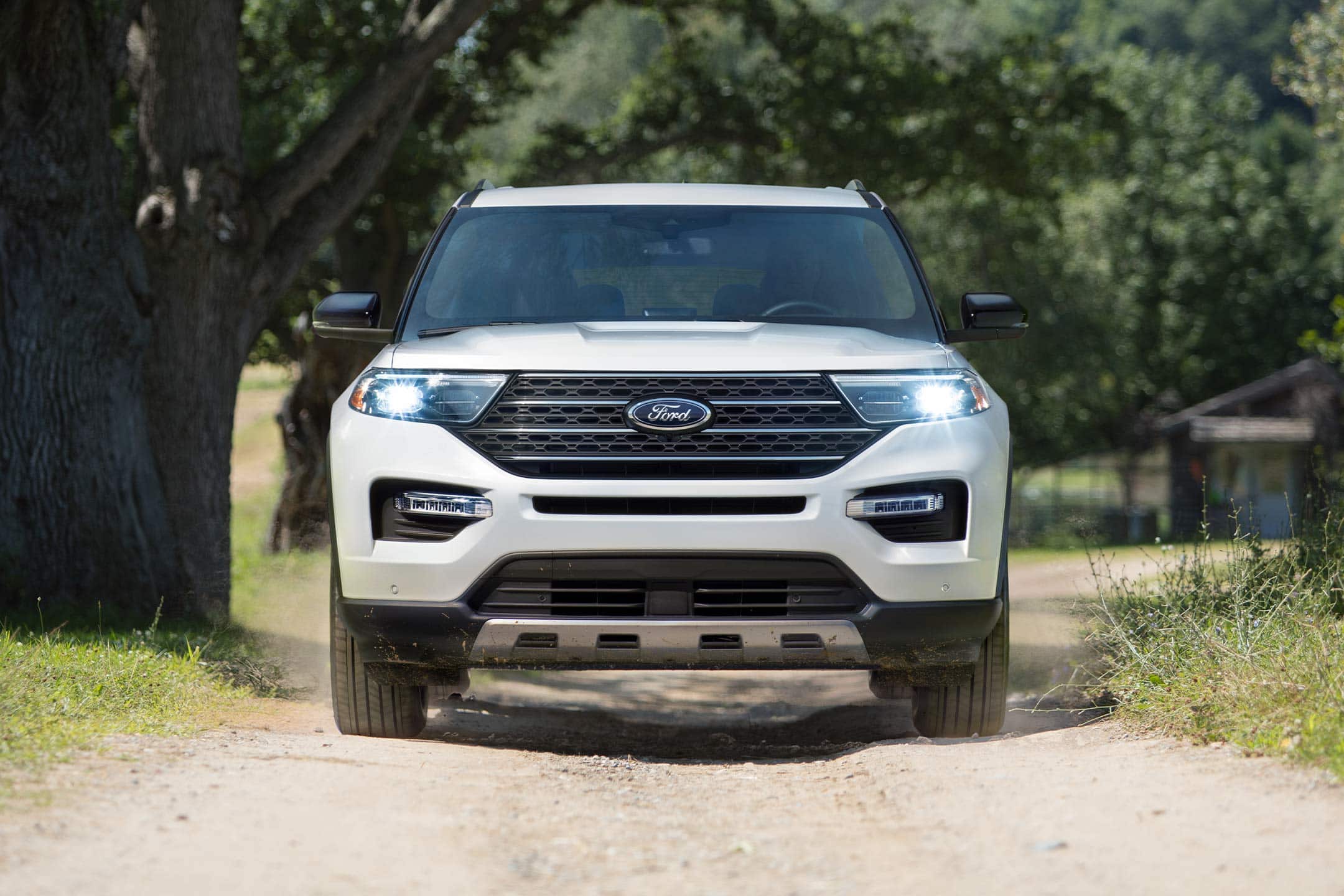 2023 Ford Explorer® King Ranch® model being driven on a dirt road