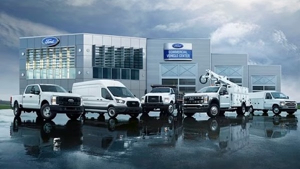 Ford Pro custom upfits vehicle lineup outside dealership.