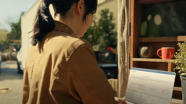 Small business owner working remotely with Ford Pro tools