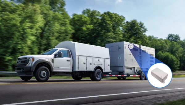 Image of a Ford F-550 XL towing a large generator on a highway.