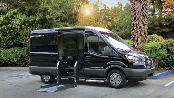 Black mobility van opening for its passengers.