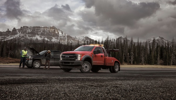 Ford super duty truck assisting a malfunctioning vehicle.