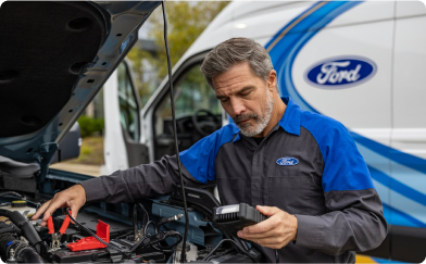 A Ford technician checking a recreational vehicle.