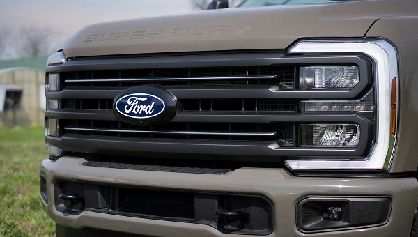 Close-up of the front grille and headlight assembly of the Super Duty.